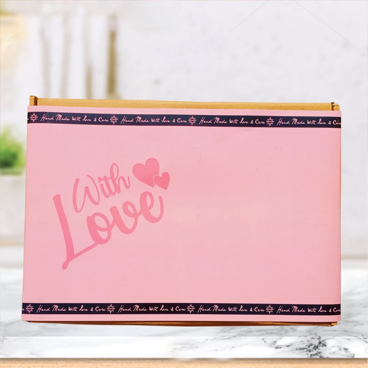 Pink gift box with 'With Love' text and hearts, handcrafted skincare packaging
