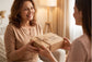 Woman receiving natural skincare gift box, eco-friendly packaging, gentle beauty products