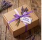 Elegant gift box with purple ribbon and lavender, perfect for birthdays